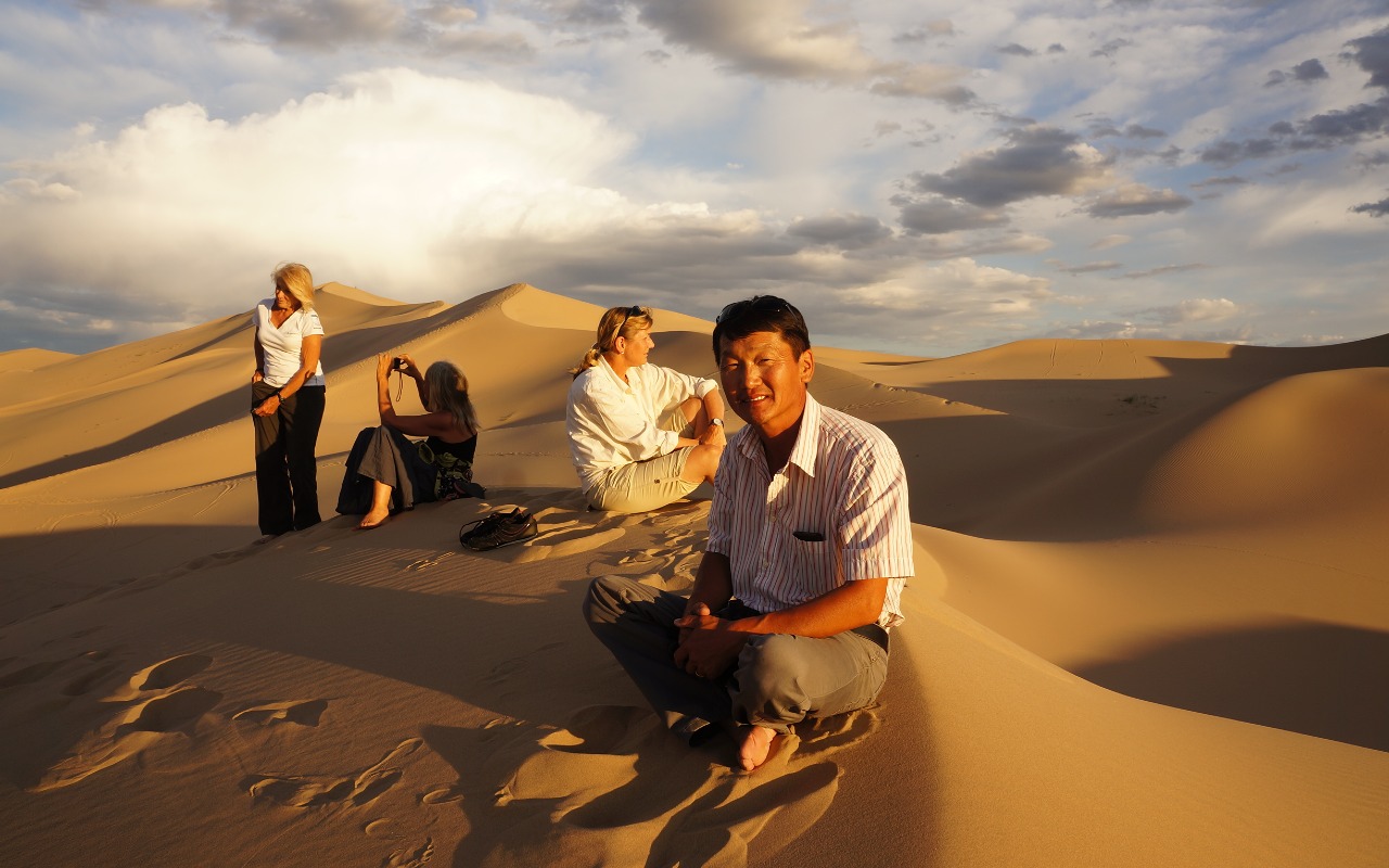 Hiking up the dunes as the sun sets | Premium Travel Mongolia